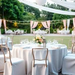 Set of stylish Table & Chair Rentals arranged for an outdoor event with elegant décor.