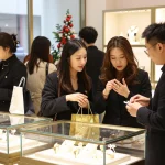 Shoppers try this out at a jewelry store, engaging and vibrant atmosphere.